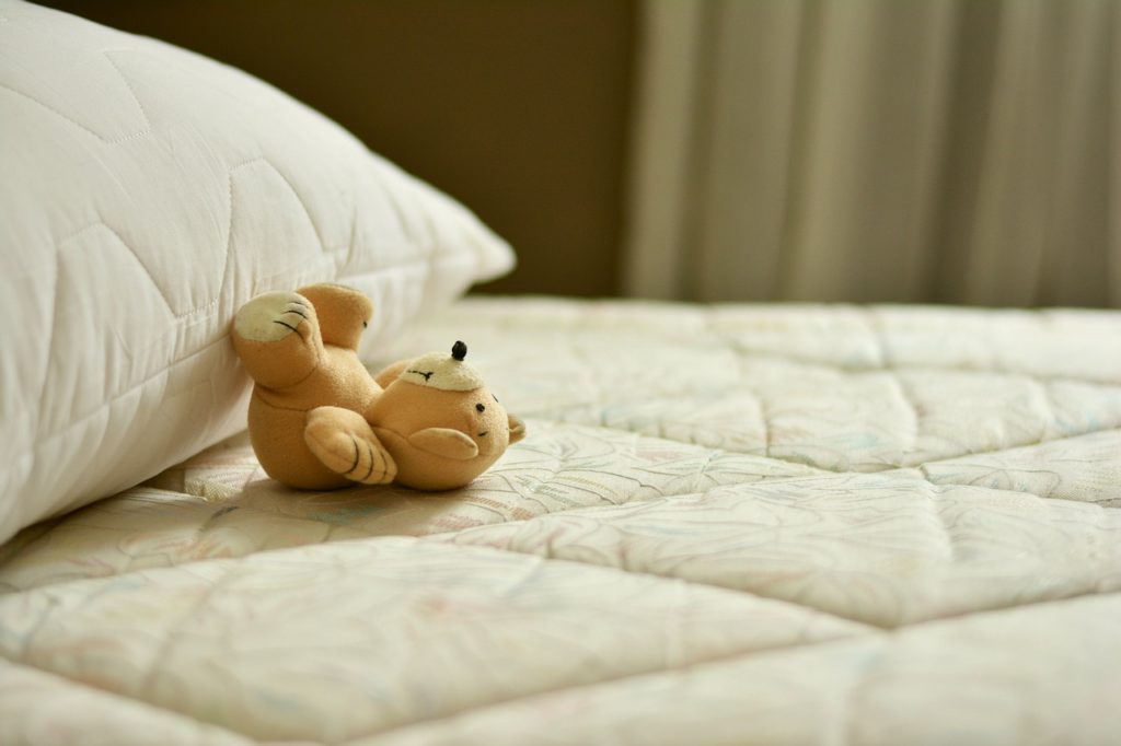 a stuff toy on a bed